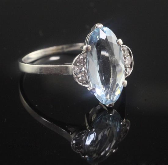 A mid 20th century platinum, aquamarine and diamond set dress ring, size Q.